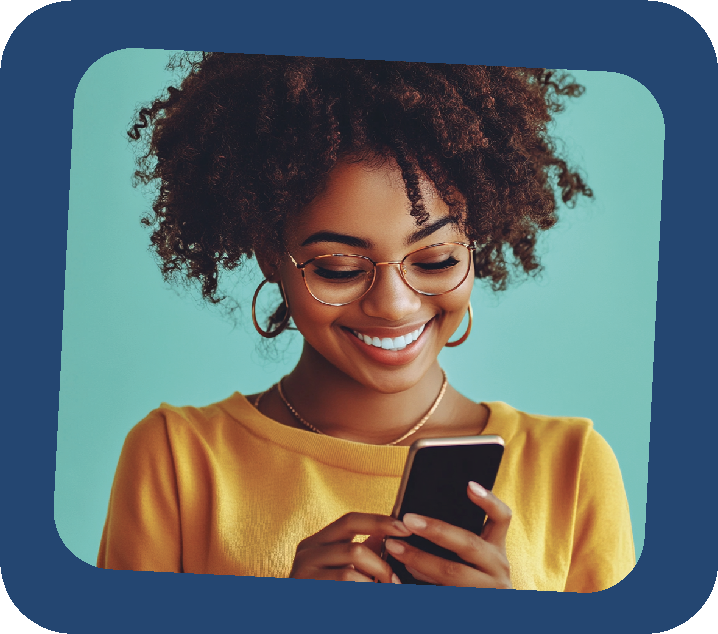 Image of a woman looking at her phone smiling